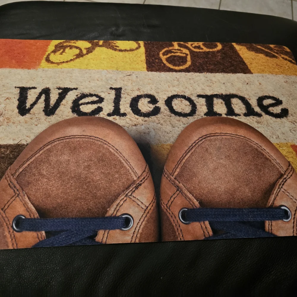 Brown Welcome Mat with Shoe Design